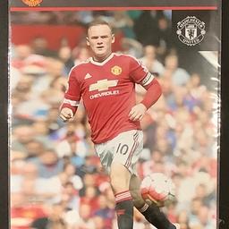 A photograph of the Man Utd legend Wayne Rooney.
Official club merchandise.
It measures 10” x 8” (approximately 25cm x 20cm).
As new - in the original packaging.