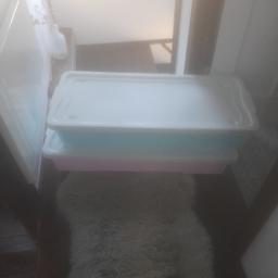 Two large storage boxes on wheels. 
One pink and one blue.
Excellent condition 
£10 for both.
NO OFFERS PLEASE