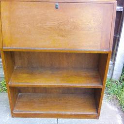 This Classic ODHAMS SOLIDA Solid wooden Bureau, top key lock with writing leaf,
also multiple storage drawers and space, lower double book shelves storage, double 
glass sliding doors,(one pair broken in transit) Otherwise in good condition,
39"high 76 length, 10" width, Collection only