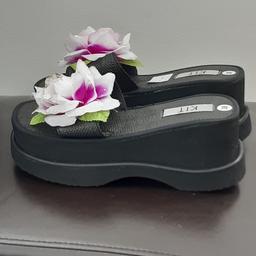Black sandals with attractive flower on front, with water look-alike droplets on flower. High wedge & sole 8 cm, size 5 (38). They look heavy but they are very lightweight. Never been worn. CASH ONLY PLEASE. BEBINGTON  area (Wirral)