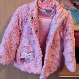 Elsa button up fleece coat with hood. Slight tear on hood but not noticeable.