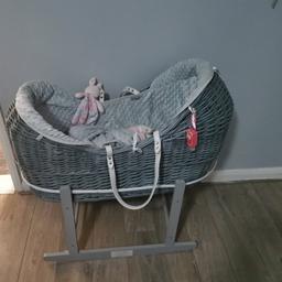 Moses basket only used for one week with extra covers in colour pink