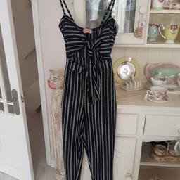 new with tag black stripe jumpsuit
sizes 8 10 12 available