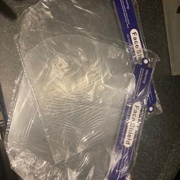 2 brand new sealed face shields.