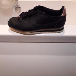 WOMENS BLACK NIKE CORTEZ TRAINERS WITH ROSE GOLD .
WORN A FEW TIMES .
SIZE 4.
NO TIME WASTERS PLZ .
NO BOX