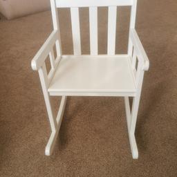 Children's white wood rocking chair. Not really been used that often but needs little touch ups on edges where it has caught on wall whilst stored. Please see pictures. Collection only.