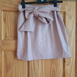 pale pink leather look skirt with bow belt size 12 worn once from smoke and pet free home collection only