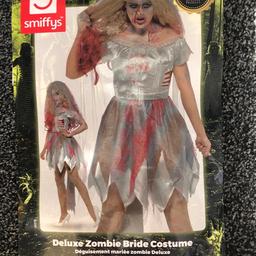 Adult Deluxe Zombie Bride Costume for Halloween 🎃👻 includes accessories 

UK Size M to fit 12/14

Deluxe Premium Quality Costume - Includes Dress which is fully elasticated and large bow detail on the back, full length veil with headband and black rose bouquet 

Brand New NEVER WORN cost £30
A TRUE BARGAIN!!!

From Smoke Free/Pet Free very clean home