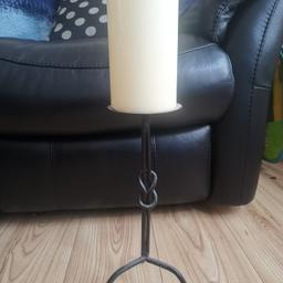 Black wrought iron floor standing candle stick holder with large candle included.