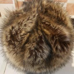 Dune Faux Fur Hat Winter Fashion. Brown, beige and black. Very good condition. Cash on collection or post at your cost I can offer free local delivery within five miles of my postcode which is LS104NF. Listed on multiple sites so it may end abruptly. Don't be disappointed. Any questions please ask and I will answer asap.