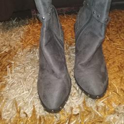 Beautiful condition Chelsea style boots has M letter in the circul not sure what brand it is, 7cm almost 3" hight heel, zip and strap fastening,and decorated with silver stud buttons. Cash on collection.