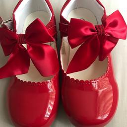 Red boutique shoes with bows on infront worn the 1 day for a wedding been sat in wardrobe in excellent condition