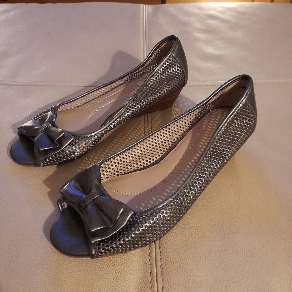 Gun metal grey metallic, peep toe small wedge sandals with laser cut holes to the main body of the sandal. worn once for a wedding. Can be collected from NW5 or post via Evri.