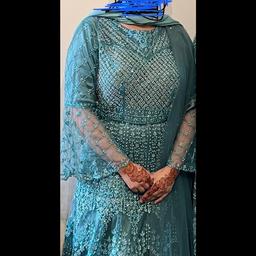 Absolutely stunning dress from raj kumari. Long teal gown with silver diamonds on full dress. Has an underskirt that gives a beautiful lift. Comes with trousers & dupatta. Only worn couple hours hence in excellent condition. An expensive buy for a fraction of price.