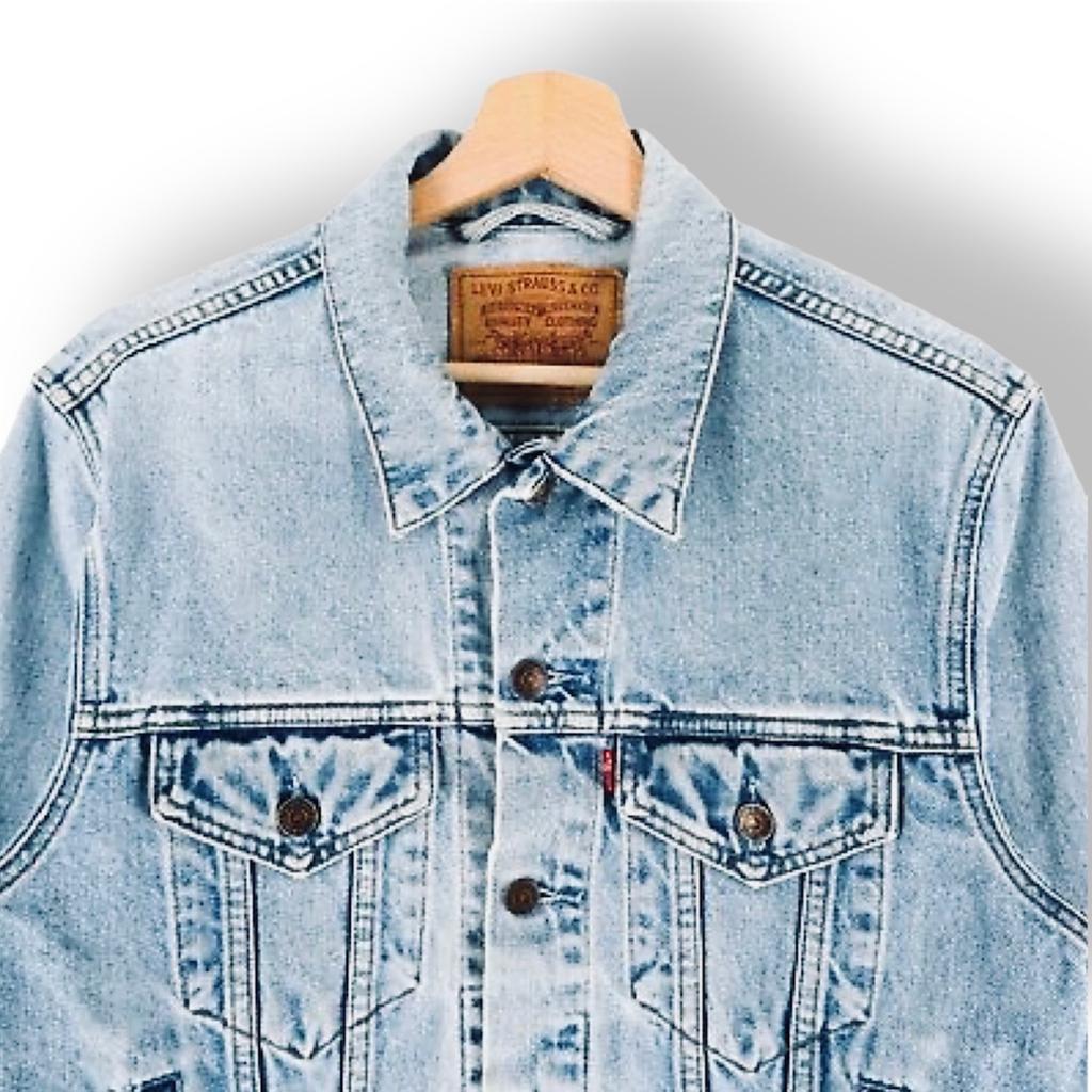 Excellent condition (Grade A)
Size S (42")
A Trucker Jacket makes an outfit—and its style endures beyond seasons and trends. Meant to be worn forever, wherever, whenever, you’d be hard-pressed to find a jacket with an easier shape, more versatile weight or inherent sense of cool.
Color: Light Stonewash - Distressed
The original jean jacket since 1967. Gets better over time with natural fading, stains and holes
* Standard fit
* Hits at hip
* 100% cotton denim
* Non-stretch
* Point collar
* Front button placket
* Standard button fastening on the man's side
* Long sleeves with button closures at cuffs
* Button-flap patch pockets at chest and welt side pockets
* Side hem adjusters
* The Levis label and red tab are present.
* Wash your Trucker Jacket sparingly. Machine washable.
Check the photos. There may be light/faint marks in places incl. pocket edges, collar, cuffs and seams. That's the beauty of a vintage Levi's distressed stone-washed j