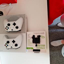 xbox one s 1tb with 2 controllers and a strike pack to improve your game play