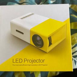 Mini LED projector in immaculate condition still in original packaging. Would make an ideal gift. Detailed description in photos.