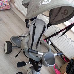 q play trike with raincover.. 
been used but not much.. 
slight sun fading on hood.. 
all materials can be taken off and washed.. 
trike can be made into a normal ride on trike or be kept as a baby trike with straps and parent handle..