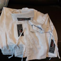 White martial arts outfit from CIMAC with white belt, size 120 ... 7-8 age range in good condition, only used at home, never used in competition.