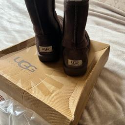 Like new authentic Brown Classic short UGG boots, comes with box and packaging. Size 4.5 UK