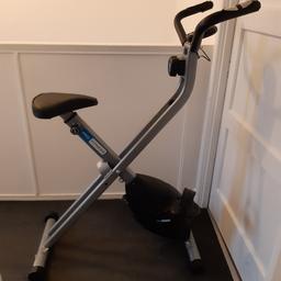 Pro fitness folding exercise bike with adjustable seat height, adjustable tension control, folds to allow easy storage, working computer with pulse, scan, calories, distance, speed and time, all in excellent condition and perfect working order
