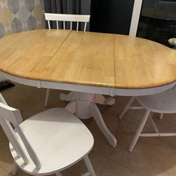 White and pine extendable wooden table. white legs and frame with pine wood table top. 3 white chairs included. Extends from small round table to large oval table.
Chairs are used more