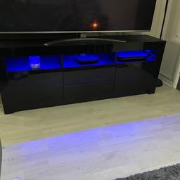 Black high gloss 
Tv media unit 
Led remote lights 
2 cupboards, 2 Draws & 3 Shelves 

Length 160cm 
Width 35cm 
Height 60cm 

RRP £160 

Collection only & Listed on other sites
