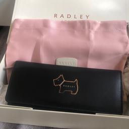 Lovely large black radley purse in very good condition. Slight marks in coin compartment. Comes with radley dust bag and gift box collection only from Sheffield s5 thanks