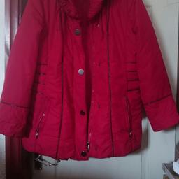 ladies winter jacket dark red/burgandy colour with black trim on sides and sleeves big padded colder for extra warmth very comfy coat says size 44 which Will fit 16/18 first to see Will defo buy.it has zip fastening with silver studs.collection only.