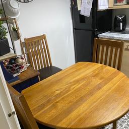 Oak table and four chairs, decent condition. Would look brilliant with a treatment.
