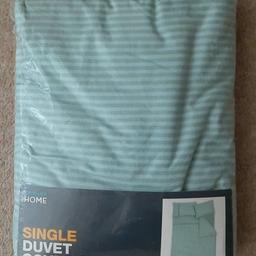 Single Duvet Cover Set with one pillowcase. Green and green stripes. Material is 50% Cotton and 50% Polyester. Used for about five nights on a holiday / retreat. Like New and has been washed. Brand is Primark Home. Size is in second photo.