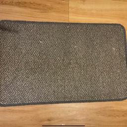 Brand new grey patterned doormat with grey wool edging and gel backing
68x42cm 
Not machine washable 
Ideal for hard flooring