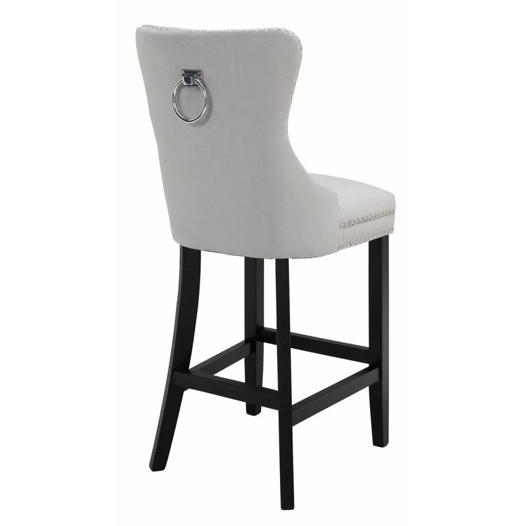 Brand new in box

Who says bar stools need to be basic? We've given this plush Princess Stud bar stool plenty of indulgent flourishes to make it fit for. . . Well a princess! We're talking studded detailing, tufted buttoning and even a decorative ring pull back!
Finished in luxurious light grey velvet style with a soft sheen appearance, this chair is perfect for leisurely late-night drinks. With a rubberwood frame and legs, it's also a sturdy choice. With this graceful stool taking pride of place, your breakfast bar will never look so good!
Chair:
•	1 chair supplied.
•	Size H103.5, W44.5, D55cm.
•	Seat height 68.5cm.
•	Foot rest.
•	Rubberwood frame with rubberwood legs.
•	Velvet seat pad.
•	Max user weight per chair 130kg.
•	Individual chair weight 8.6kg.
•	Wipe clean with a soft cloth.
Self - Assembly