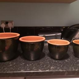 Small set of 4 pots, glaze is a green/brown colour, in some lights very dark blue/green. Really nice I just need bigger pots.
I have two sets available at £45 each set.