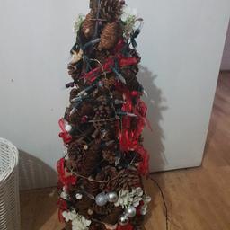 christmas pine cone tree with some bows and decorations open to offers on all Christmas items tree has lights on but needs batterys