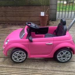 Good condition child’s ride on toy, pink fiat 500..
Safety strap. Pull out foot rest. Adjustable parent handle.
Slight wear on handles where you open and close the doors and bumper (Some silver has come off)..see picture.
100% safe.