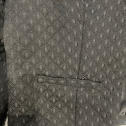 Black cropped jacket with embossed pattern . 3/4 length sleeves. Really good condition as barely worn. Can collect .