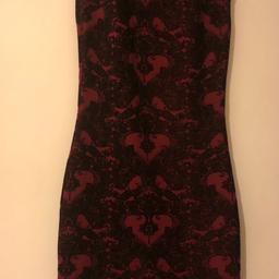 Dark red/burgundy knee length party dress, with black lace print detail.  Slip on style.   Brand new from Atmosphere with label