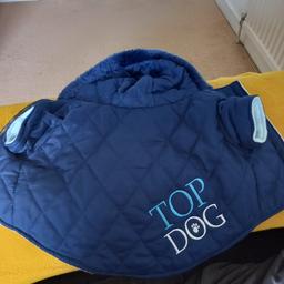 Top Dog Pet Supplies Coats Vest Jacket. Bought for my Puppy but to small. Iv sewn a tag into it to hang up. Ex con.