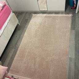 Pastel pink rug, only used once. Can be washed in the washing machine. Very clean like new, from smoke free pet free home. the measurements are 115x188cm