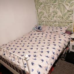 White double bed in good condition. Can come with mattress ovno