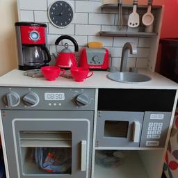 toy kitchen brought last year from aldi for my little boy. it has not been played with so brand new condition. really heavy sturdy wood. all kitchen bits seen in pic included