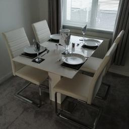 4 Modern faux leather white dining room chairs in excellent condition. Originally bought from Harveys and come from a smoke free home. 
Table is not included.
Buyer to collect only please due to the size and weight.