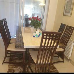 Dinning Table 180 Cm Long. 100 Cm W With Marble Top With 6 chairs and Sideboard 140Cm W X 45cm D with Marble Top and Coffee Table all Good Condition Selling Because Moving House Was £2097. Msg me if interested  Not Time Wasters  please 