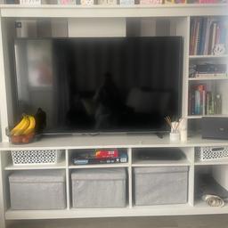 Ikea tv unit.
Similar to the Lapland however it has 4 shelves at the front and the side shelves can be adjusted to any size you want.
It has defects as seen in picture 