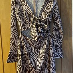 Boohoo brown zebra print tie front dress
Brand new with tag - never worn
Size 8