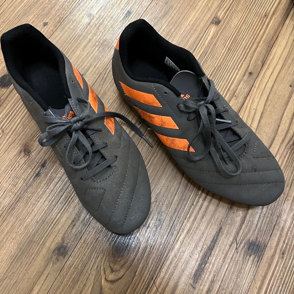 Grey and orange Adidas Football trainers, hardly used. Size uk 8.
