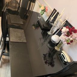 Black stylist glass table with 6 chairs. Table condition is good but chair is a little scratched. Two of the chairs have a little tear on the seat. Otherwise, all is good. This is an extended table.