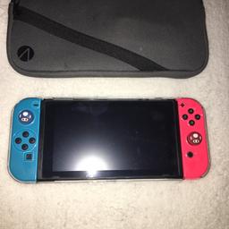 Nintendo switch in really good condition always had a hard case on it so pristine condition comes with charger and carry case