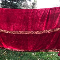 Gorgeous vintage velvet throw.. It’s a really large heavy velvet throw. Rich red with lots of gold brocade details. Amazing wood bead with gold tassels to corners. One tassel is missing but bead is there so it’s easy to replace the tassel. Looks really amazing as a throw on a sofa or bed. . You won’t be disappointed . I just haven’t room for this so unfortunately selling. Beautiful  quality item 